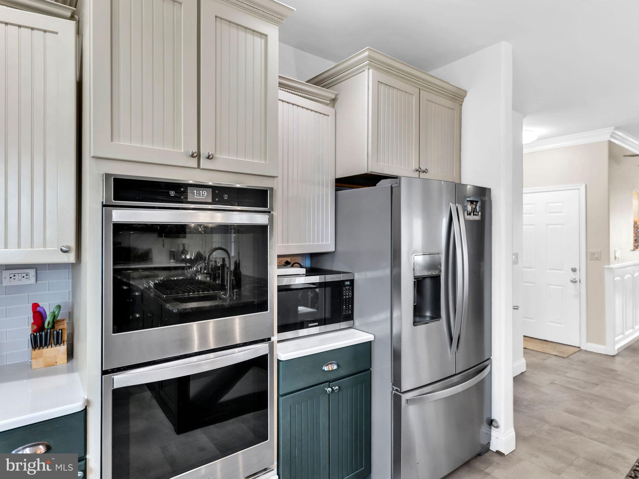12608 Selsey Road Ocean City, MD 21842 - Photo 20 of 66 a kitchen with stainless steel appliances granite countertop a refrigerator and a stove top oven