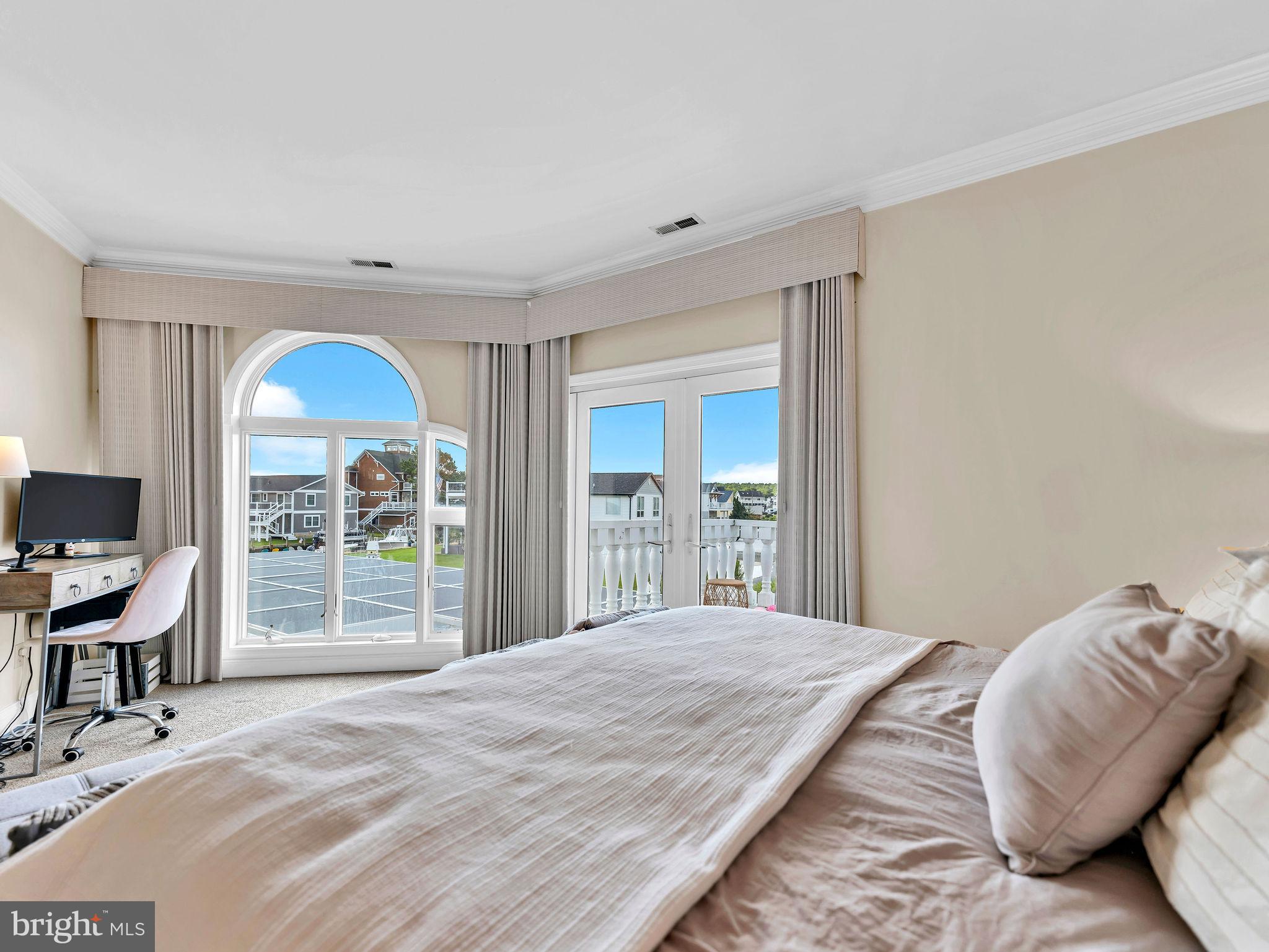 12608 Selsey Road Ocean City, MD 21842 - Photo 30 of 66 a bedroom with a bed and a chair