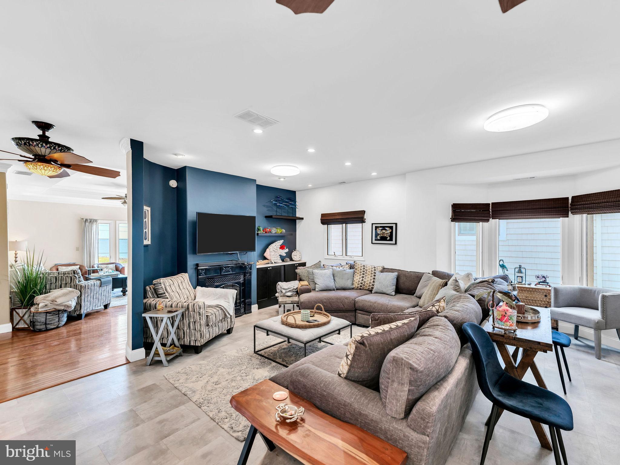 12608 Selsey Road Ocean City, MD 21842 - Photo 3 of 66 a living room with furniture and a flat screen tv