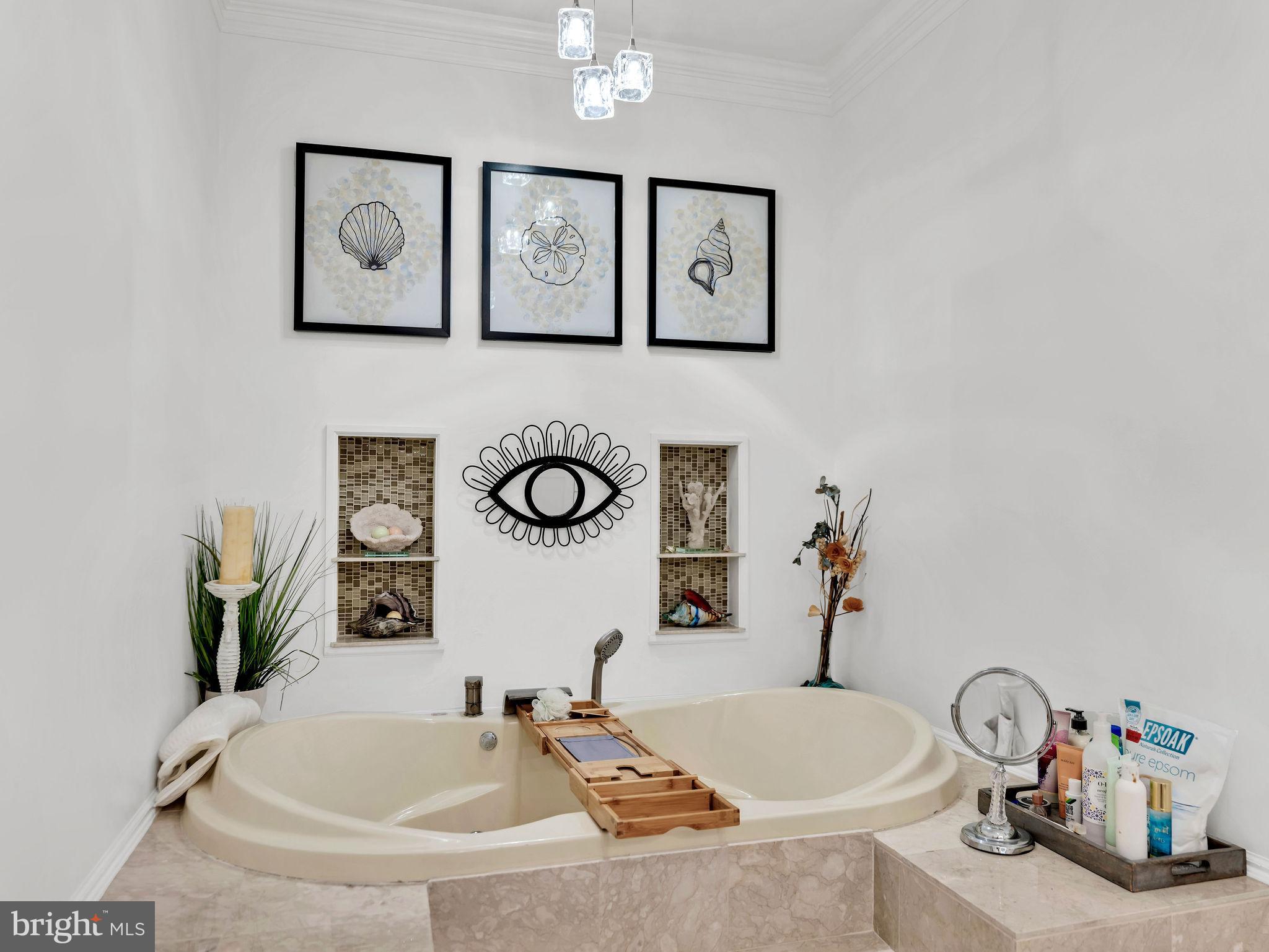 12608 Selsey Road Ocean City, MD 21842 - Photo 32 of 66 a bathroom with a tub sink and mirror