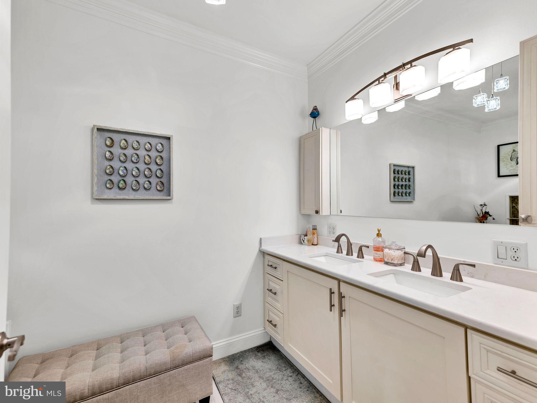 12608 Selsey Road Ocean City, MD 21842 - Photo 33 of 66 a bathroom with a sink a vanity and a mirror