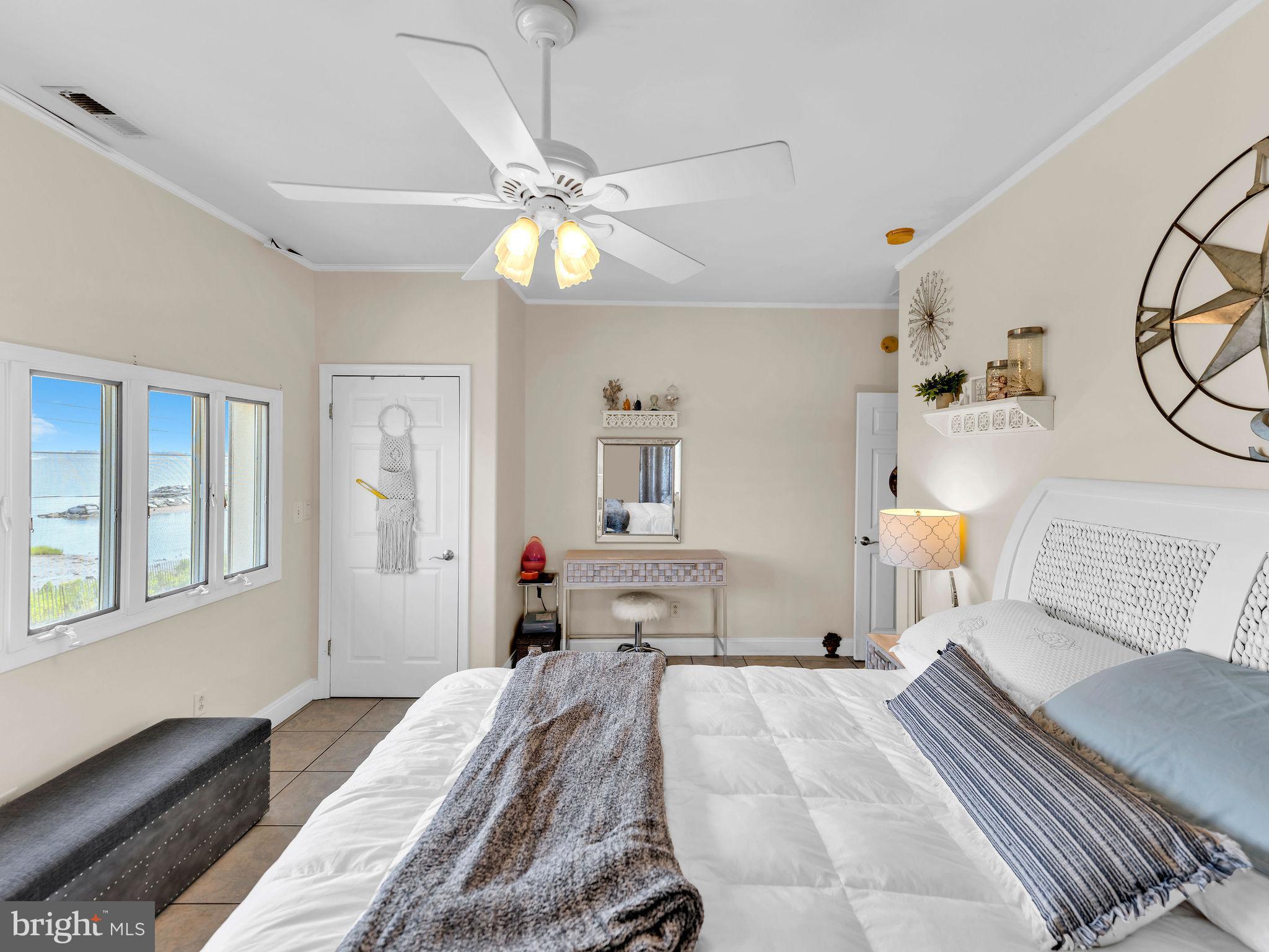 12608 Selsey Road Ocean City, MD 21842 - Photo 37 of 66 a bedroom with a bed and wooden floor