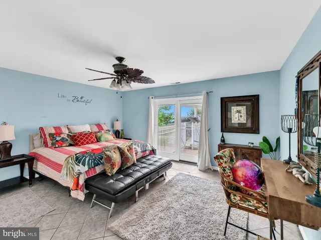 a view of a living room and bedroom