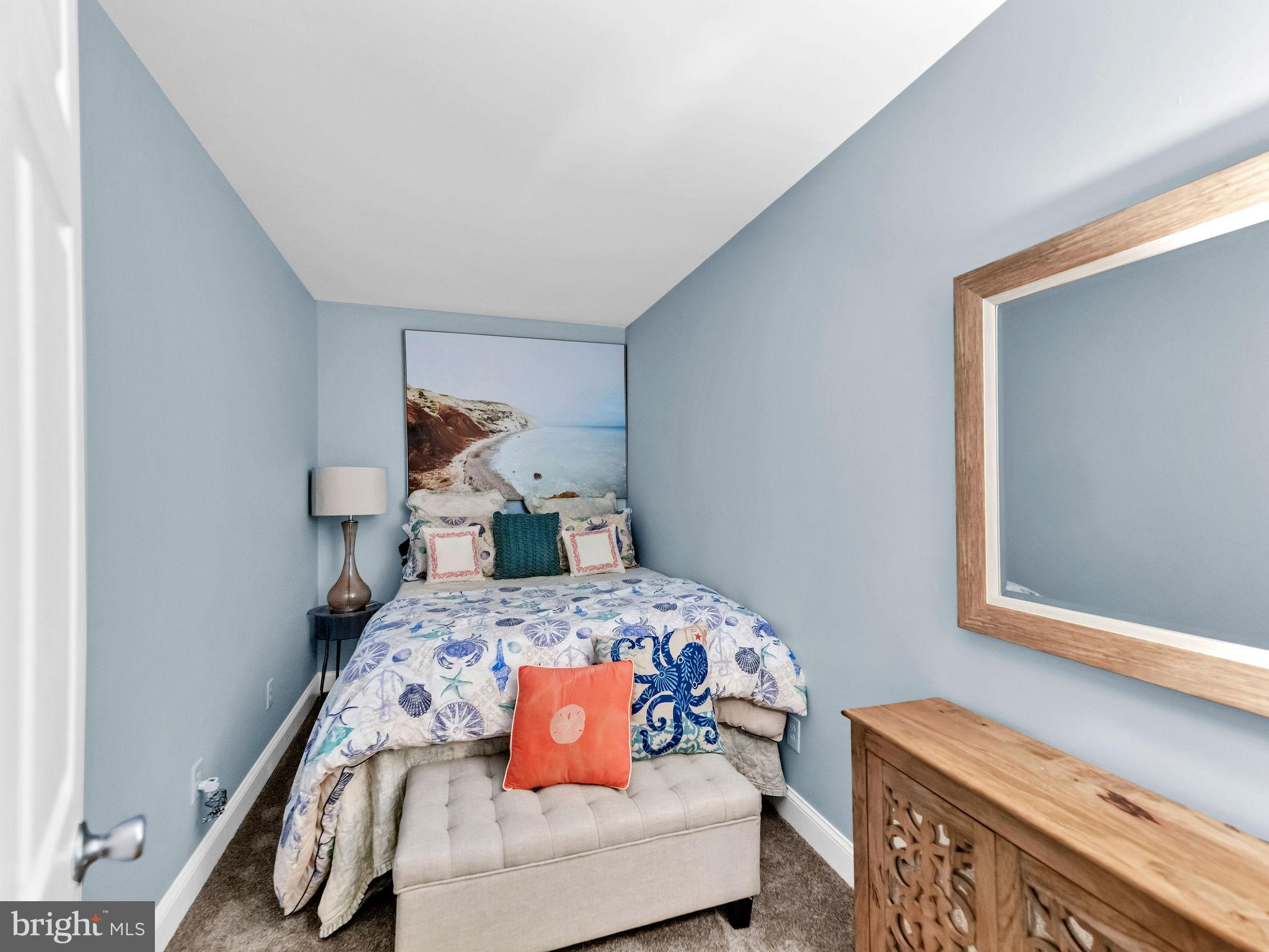 12608 Selsey Road Ocean City, MD 21842 - Photo 40 of 66 a bedroom with a bed and a window