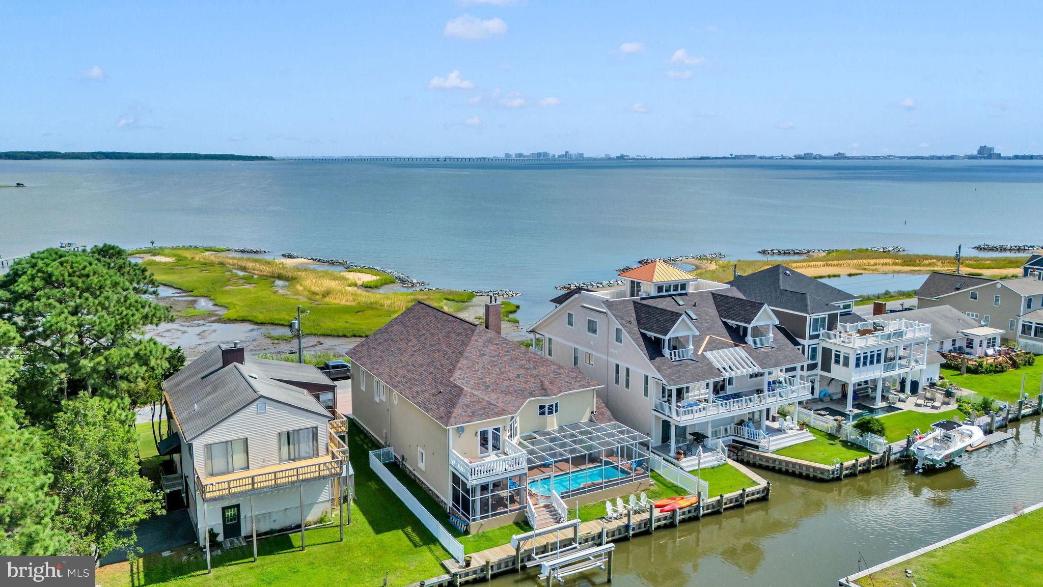 12608 Selsey Road Ocean City, MD 21842 - Photo 50 of 66 an aerial view of a house with a swimming pool and outdoor seating