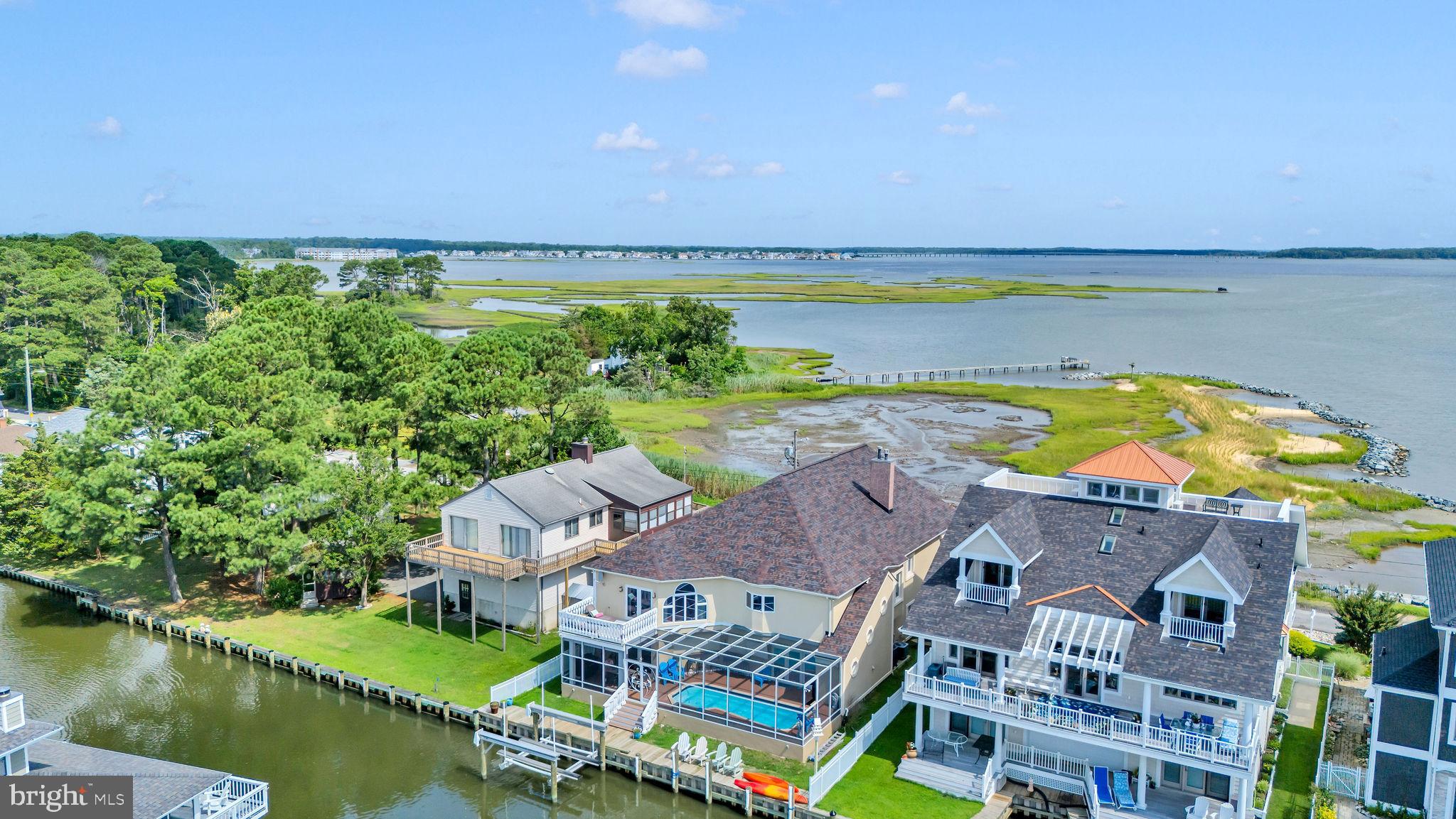 12608 Selsey Road Ocean City, MD 21842 - Photo 51 of 66 an aerial view of a house with a swimming pool outdoor seating and yard