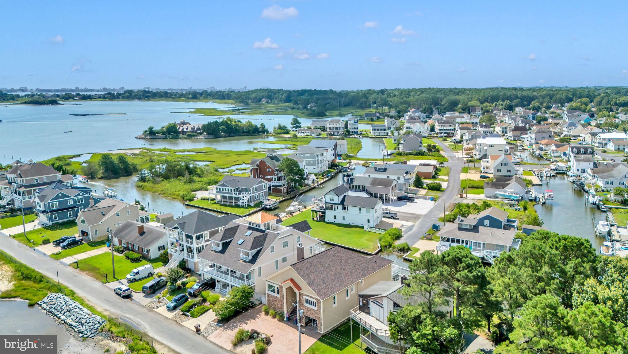 12608 Selsey Road Ocean City, MD 21842 - Photo 59 of 66 an aerial view of a house with a swimming pool outdoor seating and yard