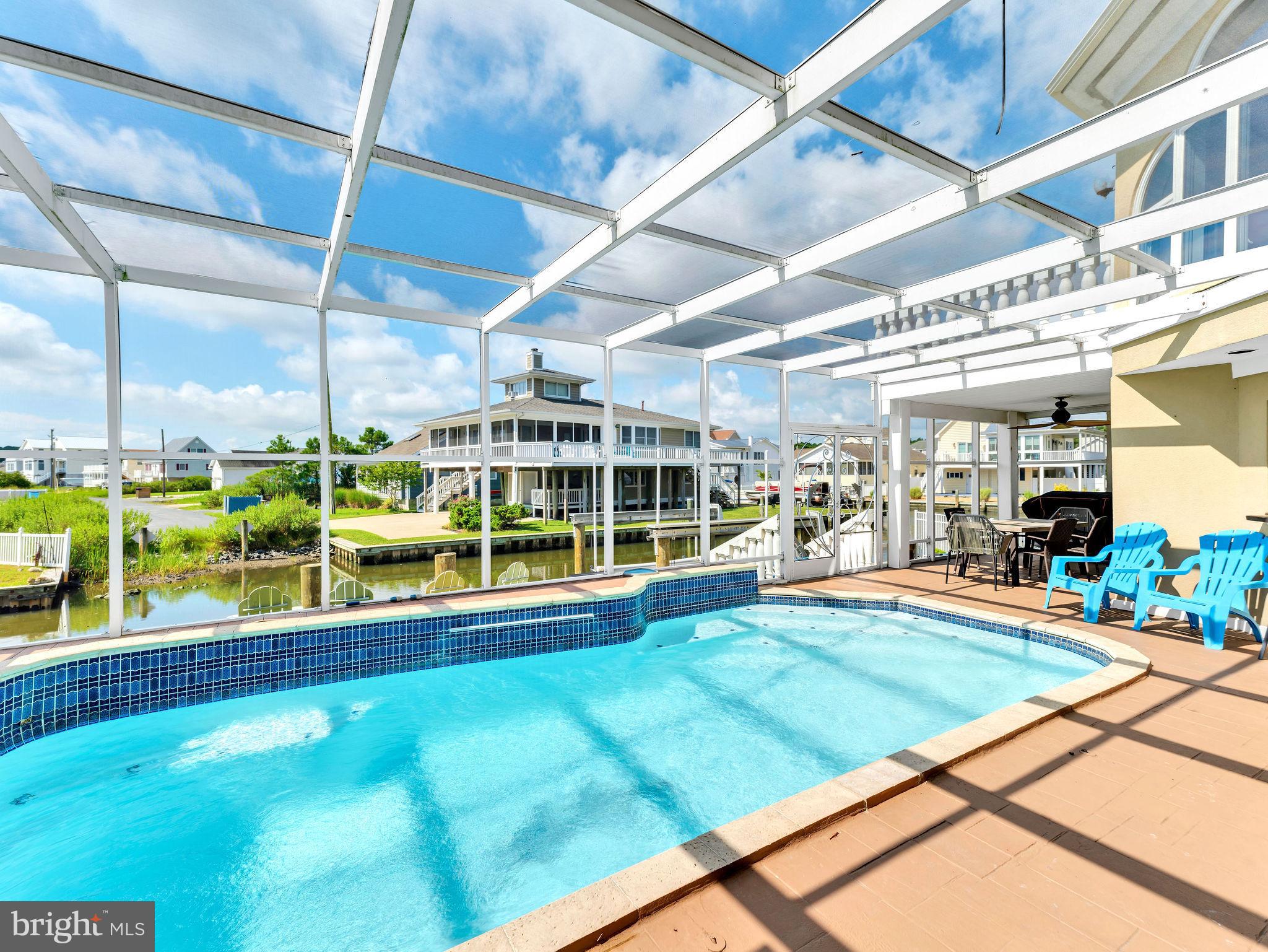 12608 Selsey Road Ocean City, MD 21842 - Photo 8 of 66 a view of an empty room with a swimming pool