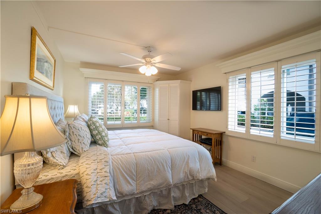 388 4th Avenue South, Unit 388 Naples, FL 34102 - Photo 2 of 15 a bedroom with a bed and a window
