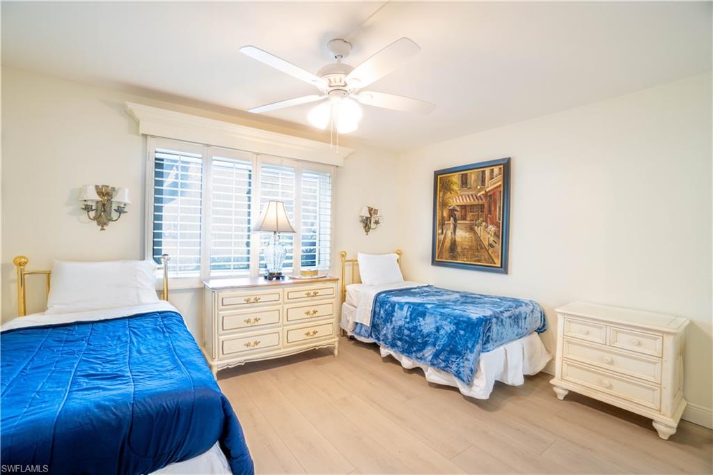 388 4th Avenue South, Unit 388 Naples, FL 34102 - Photo 6 of 15 a spacious bedroom with a bed and a window