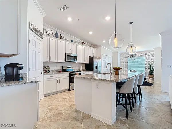 a kitchen with cabinets a sink and a stove