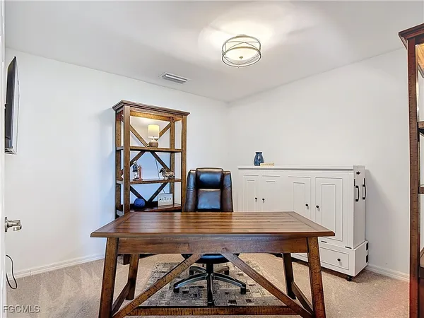 a view of a livingroom with furniture and window