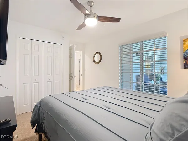 a bathroom with a granite countertop shower sink and mirror