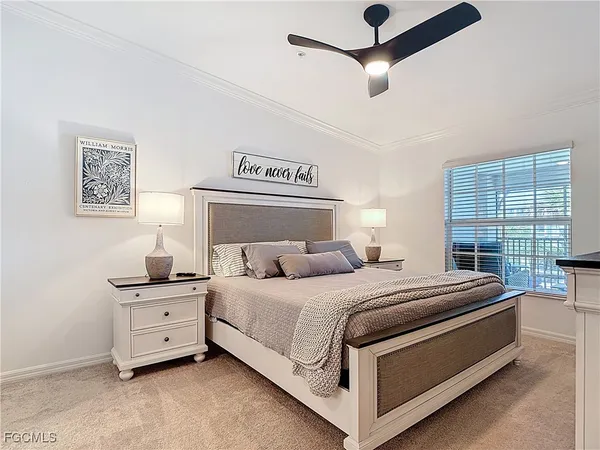 a bedroom with a flat screen television and a bed