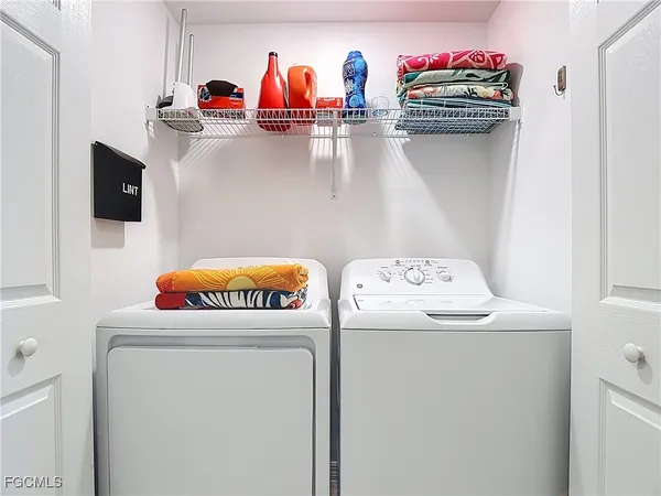 a utility room with dryer and washer