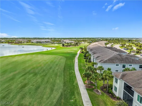 a view of a swimming pool with a yard