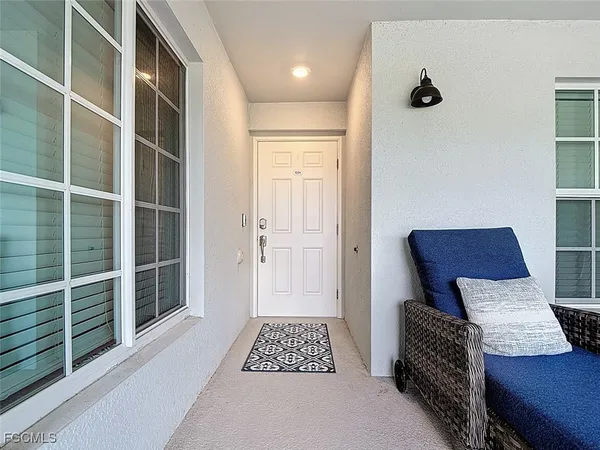 a view of furniture in a room with a window