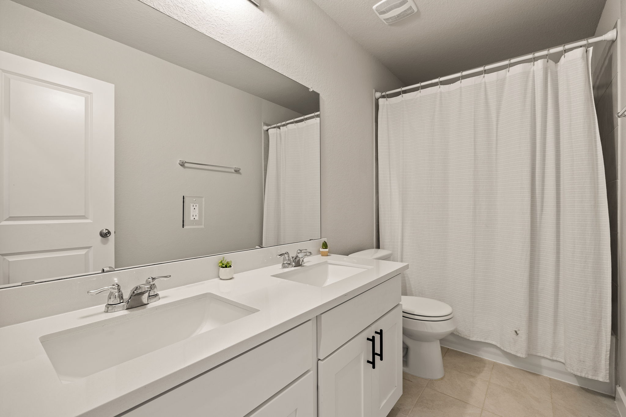 2233 Calvert Drive Leander, TX 78641 - Photo 26 of 32 The full bath upstairs is complete with a dual vanity.