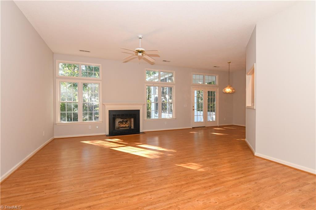 5407 Chestnut Ridge Drive Summerfield, NC 27358 - Photo 4 of 20 Natural light through windows that go all the way to the ten foot ceiling! Lovely floors. The living room has a floor jack so that furniture can be easily arranged.