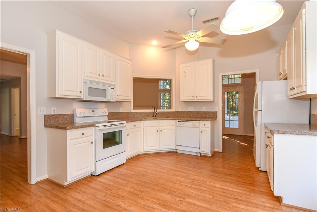 5407 Chestnut Ridge Drive Summerfield, NC 27358 - Photo 9 of 20 Big kitchen with excellent layout and workspace. There is a pantry and the refrigerator remains (second refrig in garage stays too)