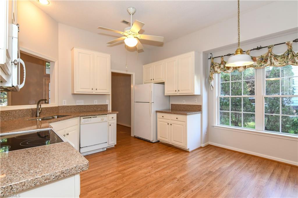 5407 Chestnut Ridge Drive Summerfield, NC 27358 - Photo 10 of 20 Solid surface countertop, lots of cabinets for storage and more lovely light and views
