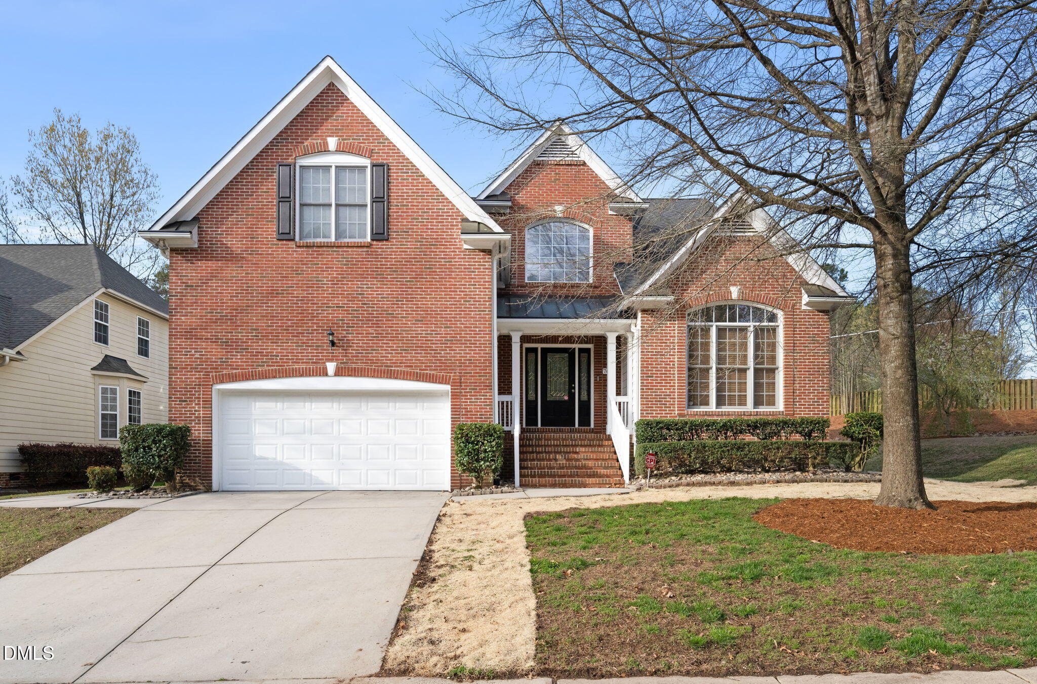 707 Martry Road Durham, NC 27713 - Photo 1 of 61 a front view of a house with a yard and garage