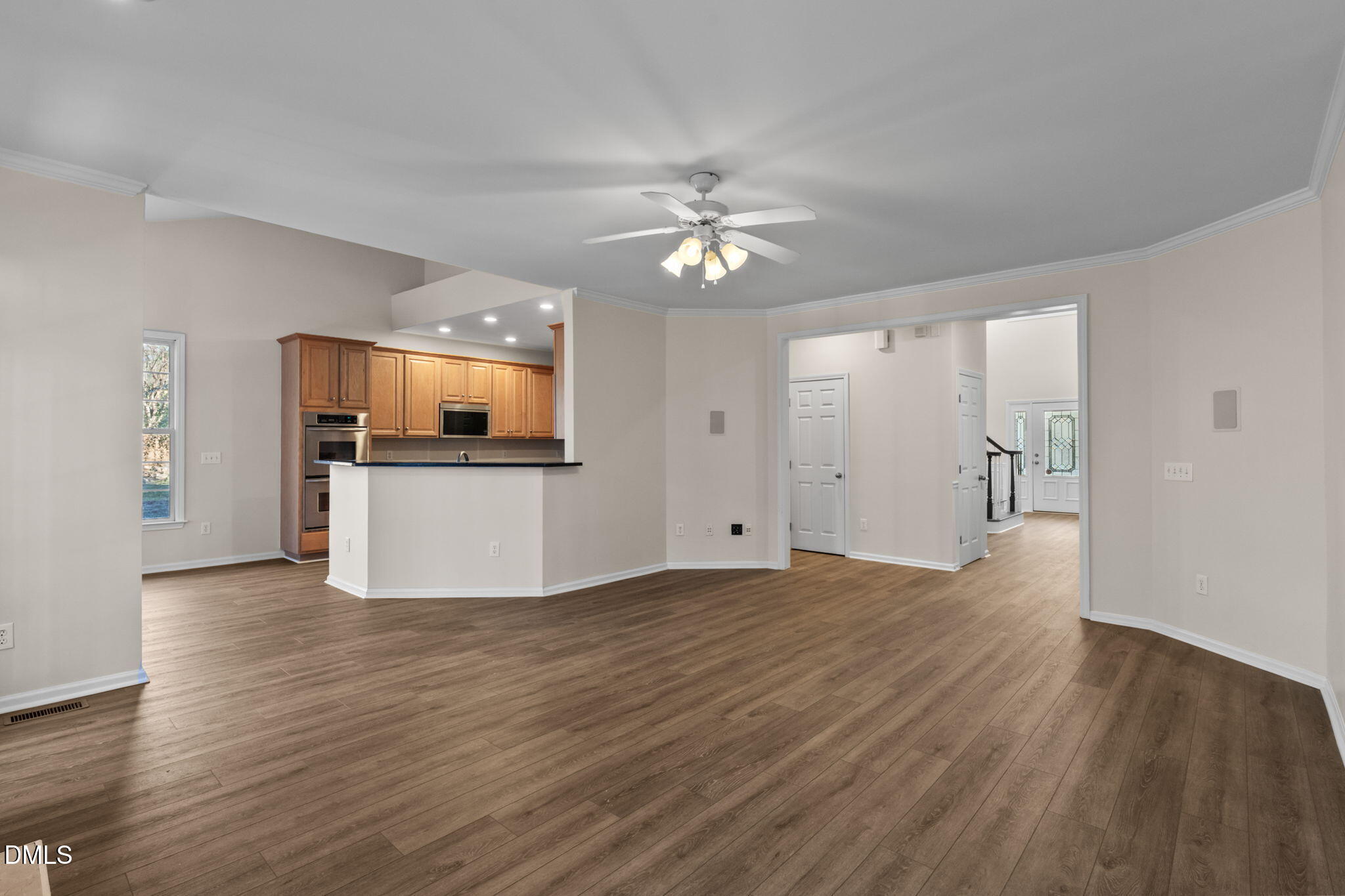 707 Martry Road Durham, NC 27713 - Photo 11 of 61 a view of a kitchen with wooden floor and a kitchen space with a sink