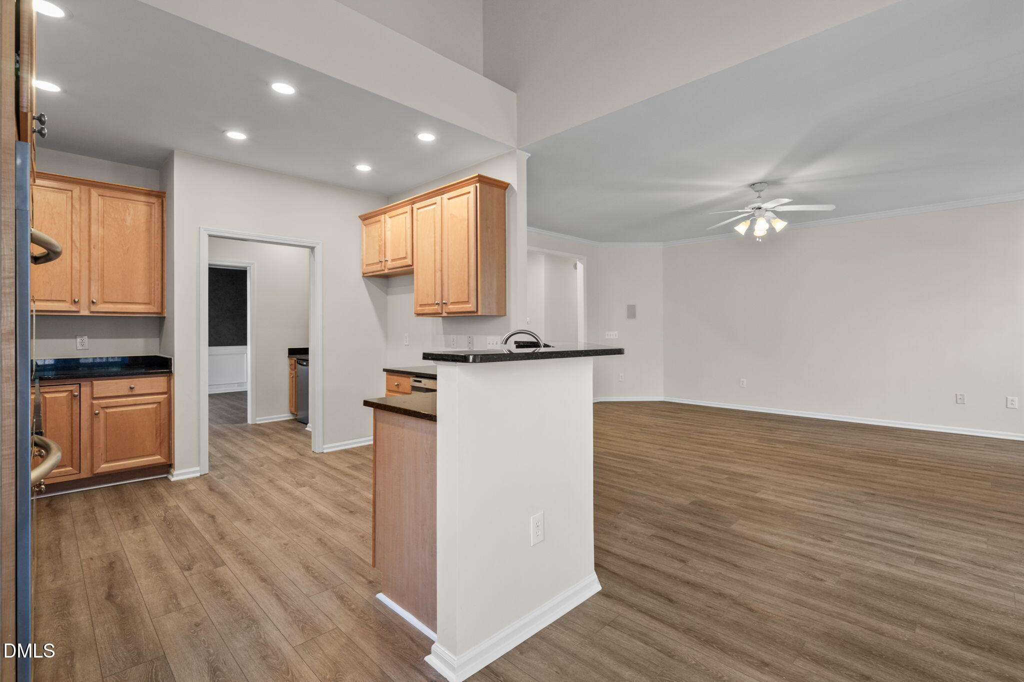 707 Martry Road Durham, NC 27713 - Photo 14 of 61 a view of kitchen with cabinets and wooden floor