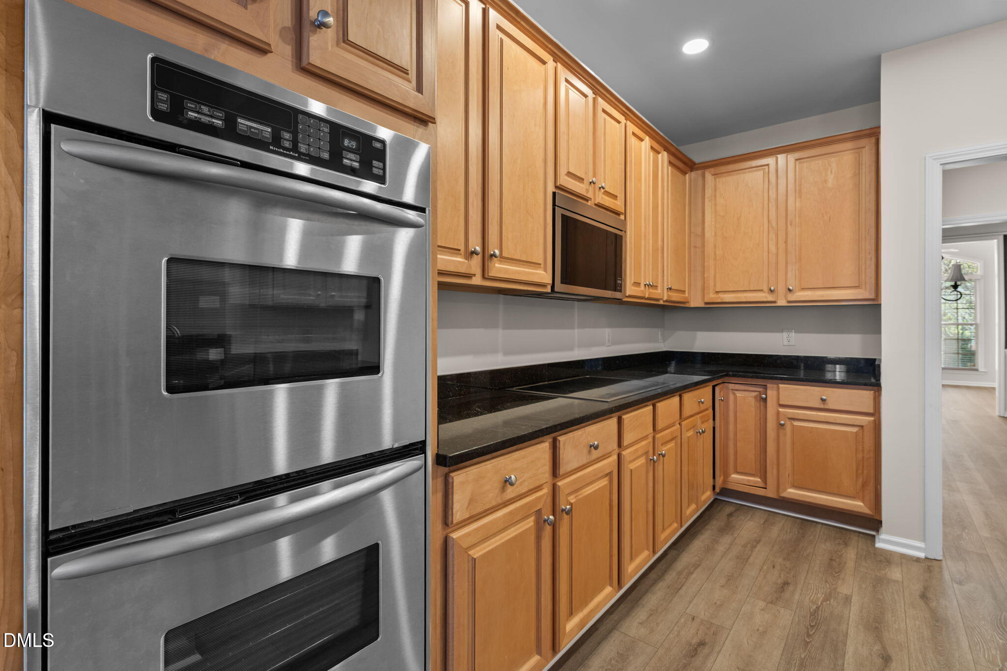 707 Martry Road Durham, NC 27713 - Photo 16 of 61 a kitchen with stainless steel appliances granite countertop a stove and a microwave
