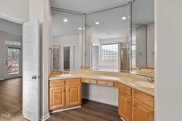 a bathroom with a tub shower and sink
