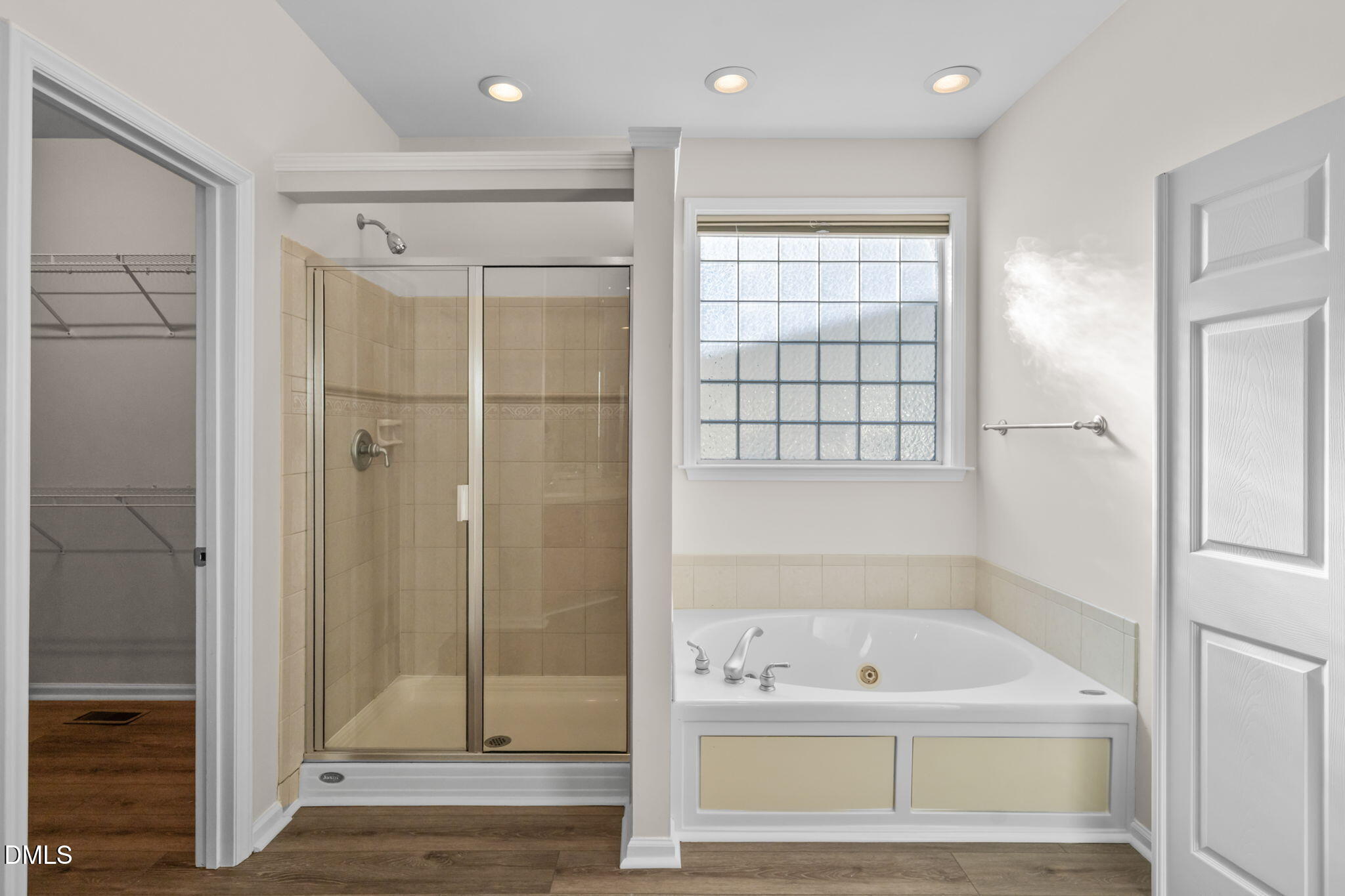 707 Martry Road Durham, NC 27713 - Photo 24 of 61 a bathroom with a tub shower and sink