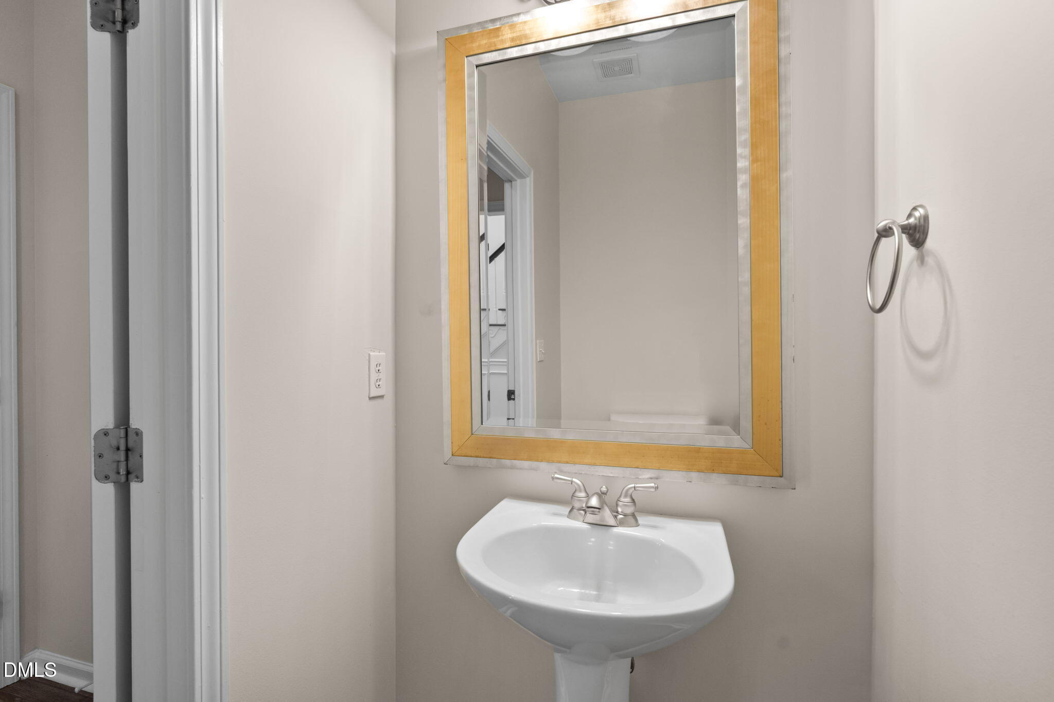 707 Martry Road Durham, NC 27713 - Photo 26 of 61 a bathroom with a sink and a mirror