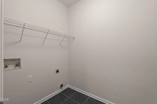 a view of a hallway with a window