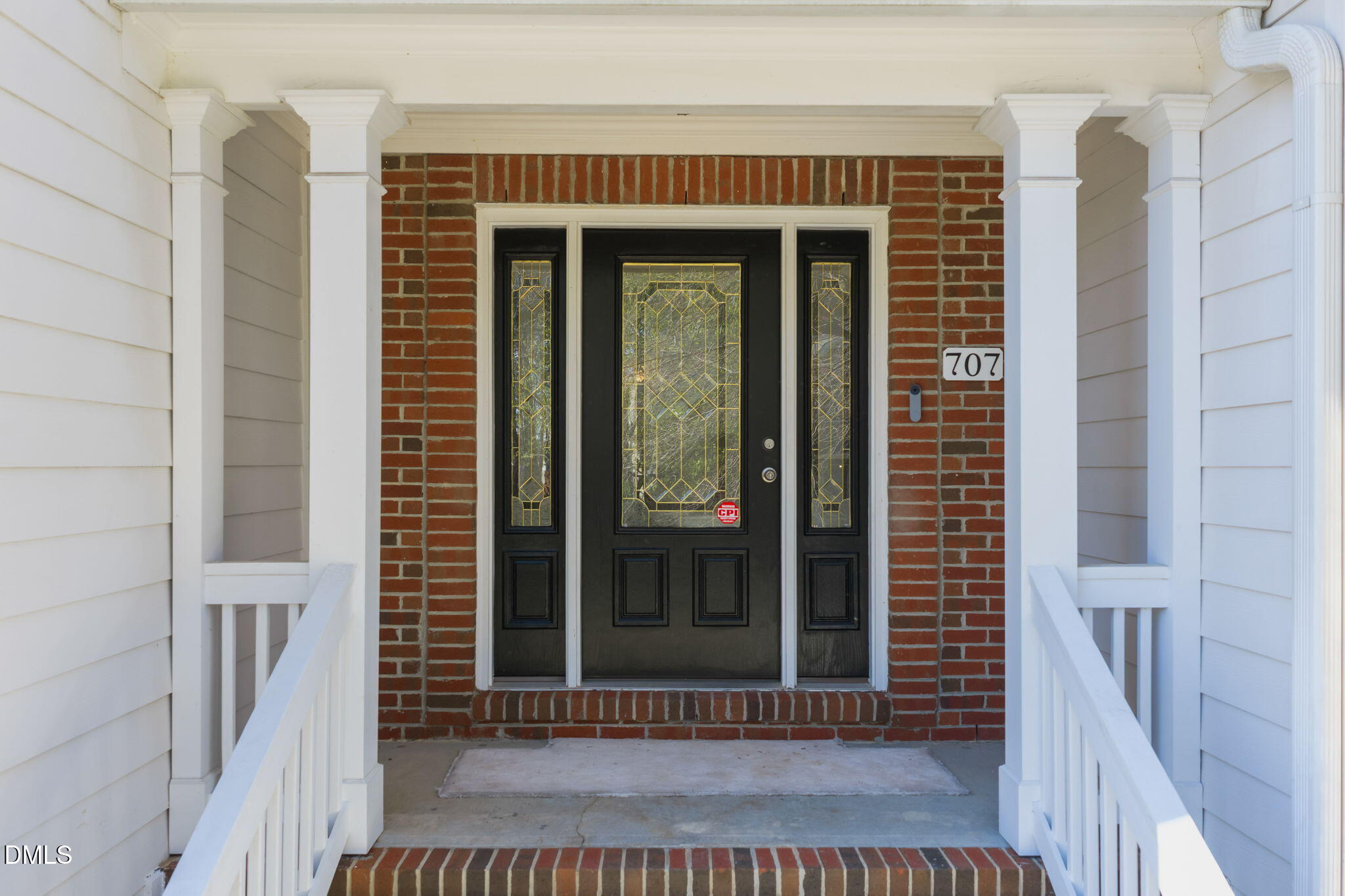 707 Martry Road Durham, NC 27713 - Photo 2 of 61 a view of a brick house with a large window