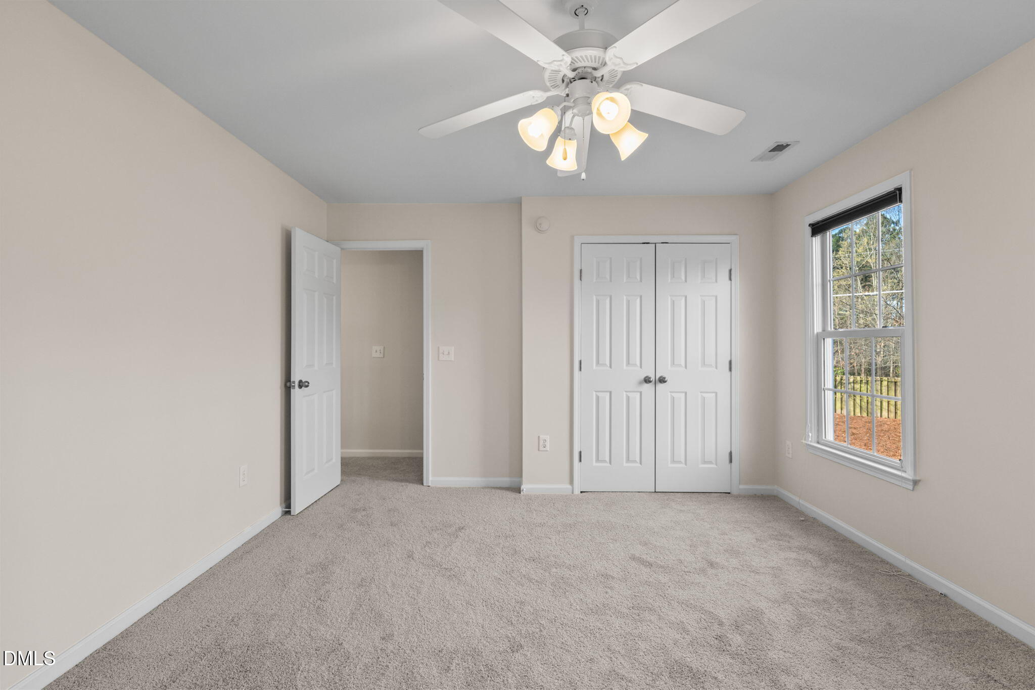 707 Martry Road Durham, NC 27713 - Photo 37 of 61 an empty room with windows and fan