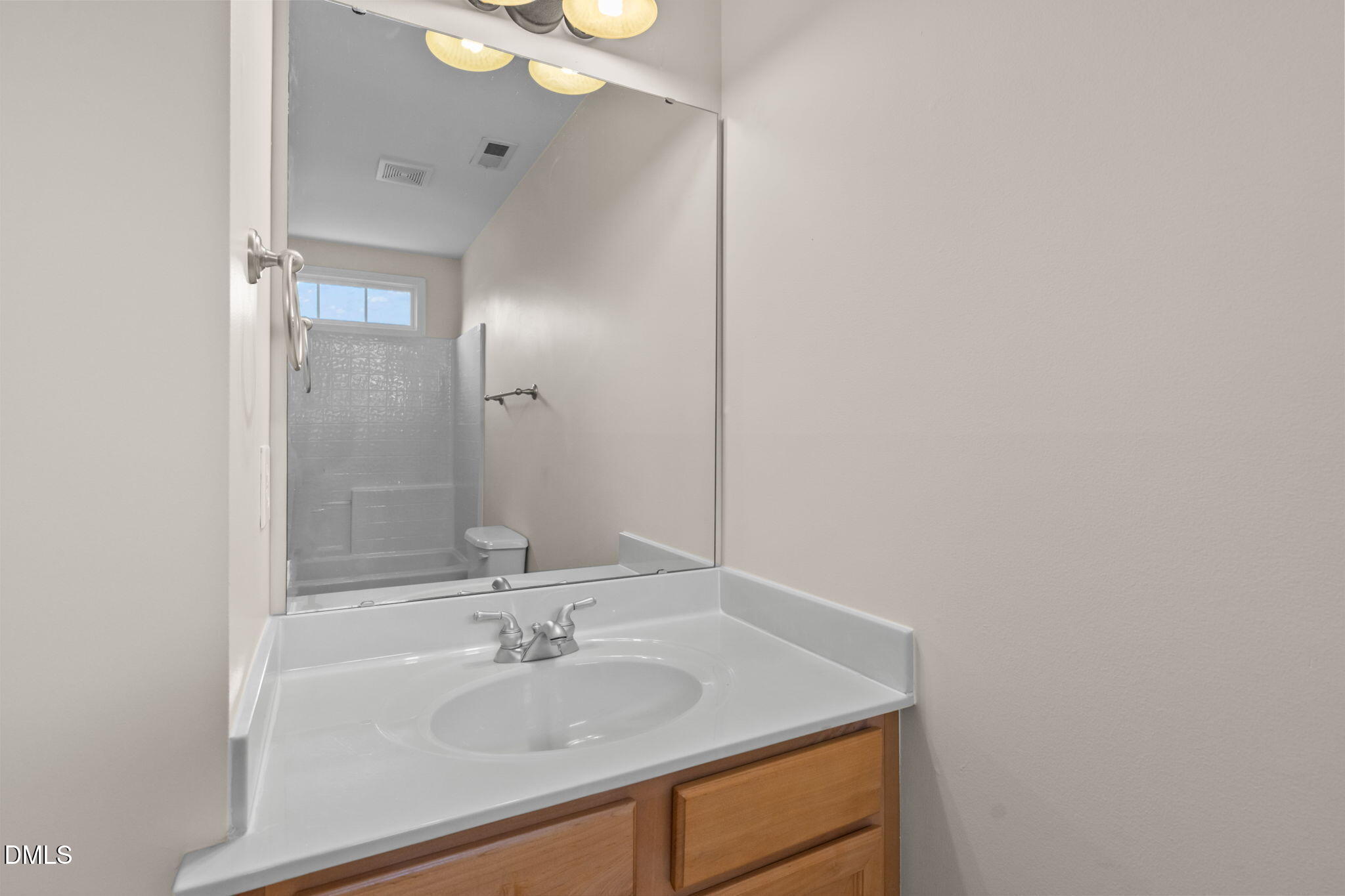 707 Martry Road Durham, NC 27713 - Photo 39 of 61 a bathroom with a sink and a mirror