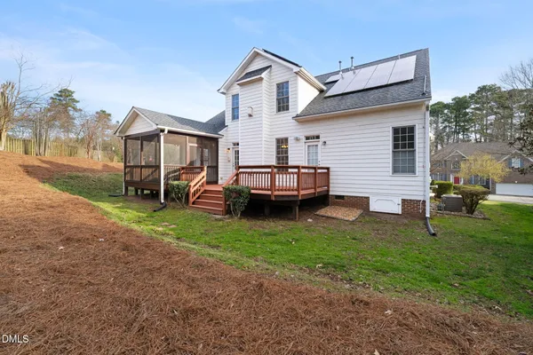 a view of a house with a yard and garage