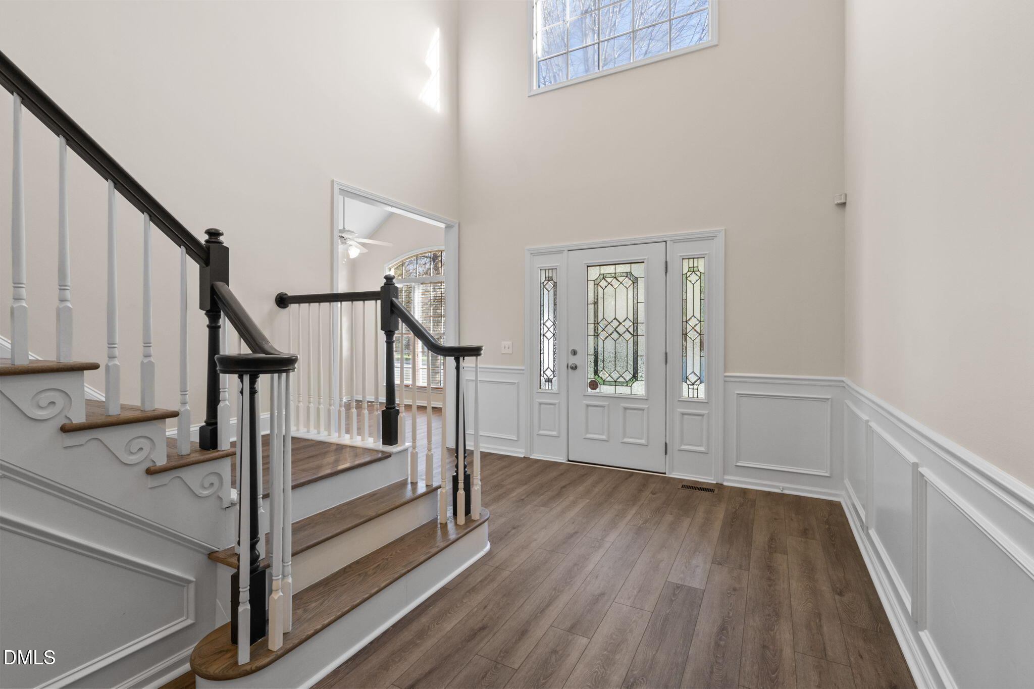 707 Martry Road Durham, NC 27713 - Photo 3 of 61 a view of front door with hallway and wooden floor