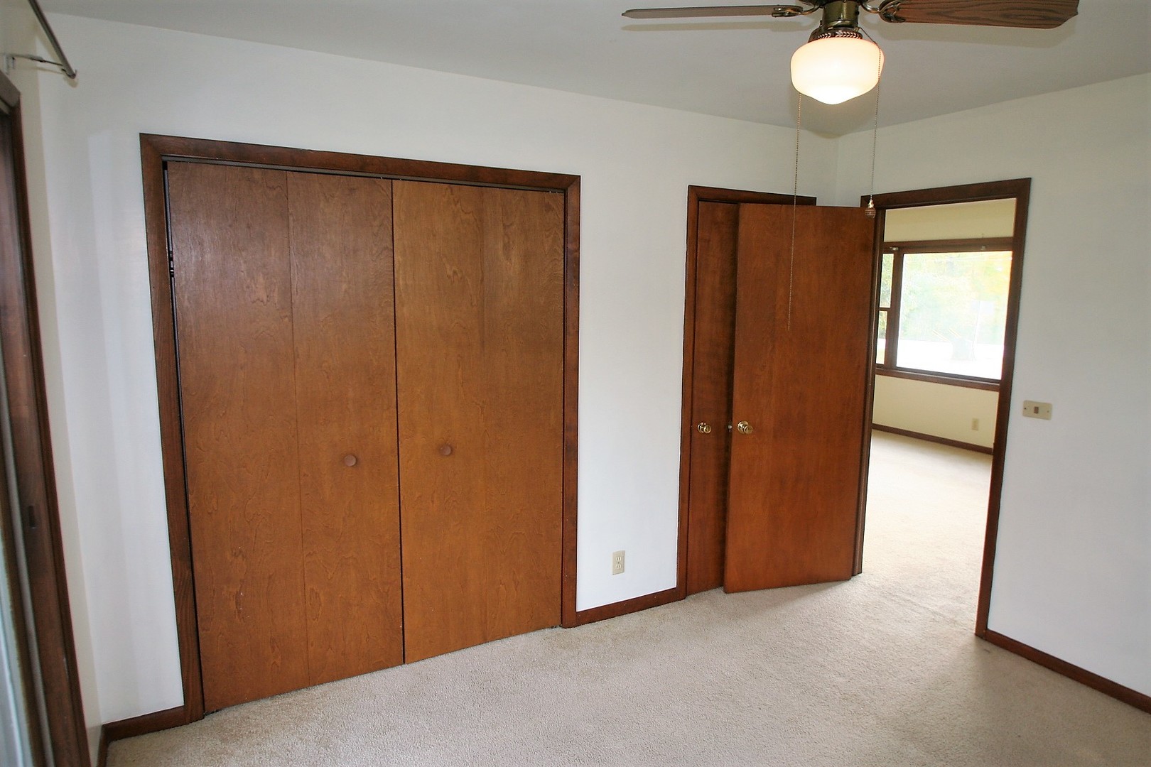 15998 Dee-Mac Road Mackinaw, IL 61755 - Photo 13 of 22 an empty room with closet and mirror
