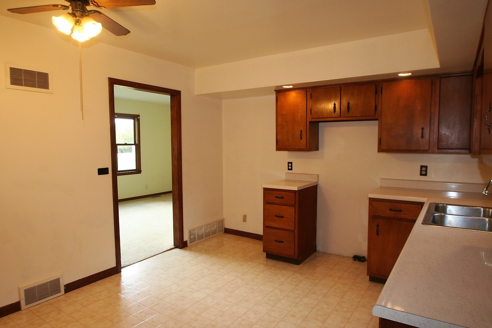 15998 Dee-Mac Road Mackinaw, IL 61755 - Photo 2 of 22 a view of an empty room with window and wooden floor