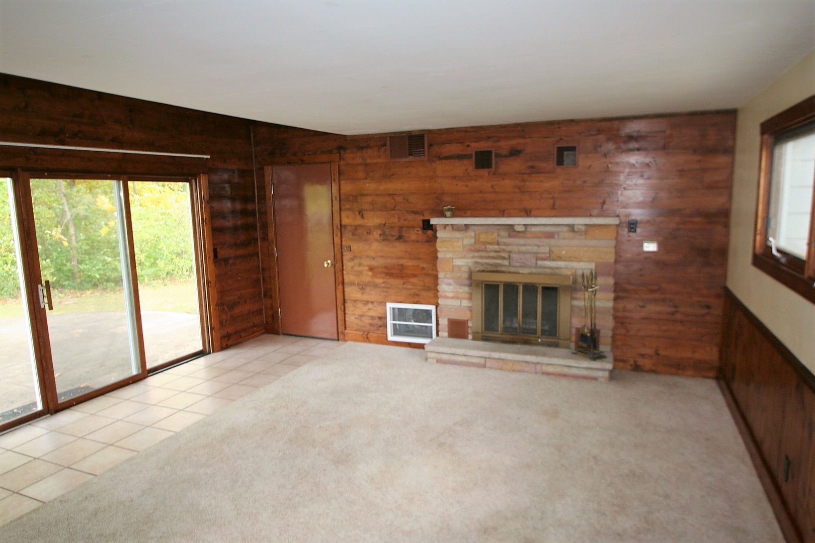 15998 Dee-Mac Road Mackinaw, IL 61755 - Photo 4 of 22 a view of an empty room with a fireplace