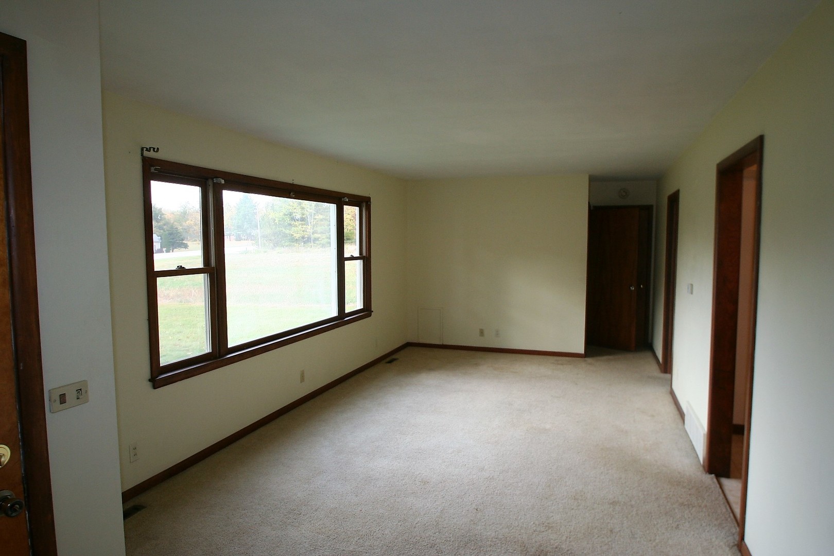 15998 Dee-Mac Road Mackinaw, IL 61755 - Photo 5 of 22 an empty room with windows