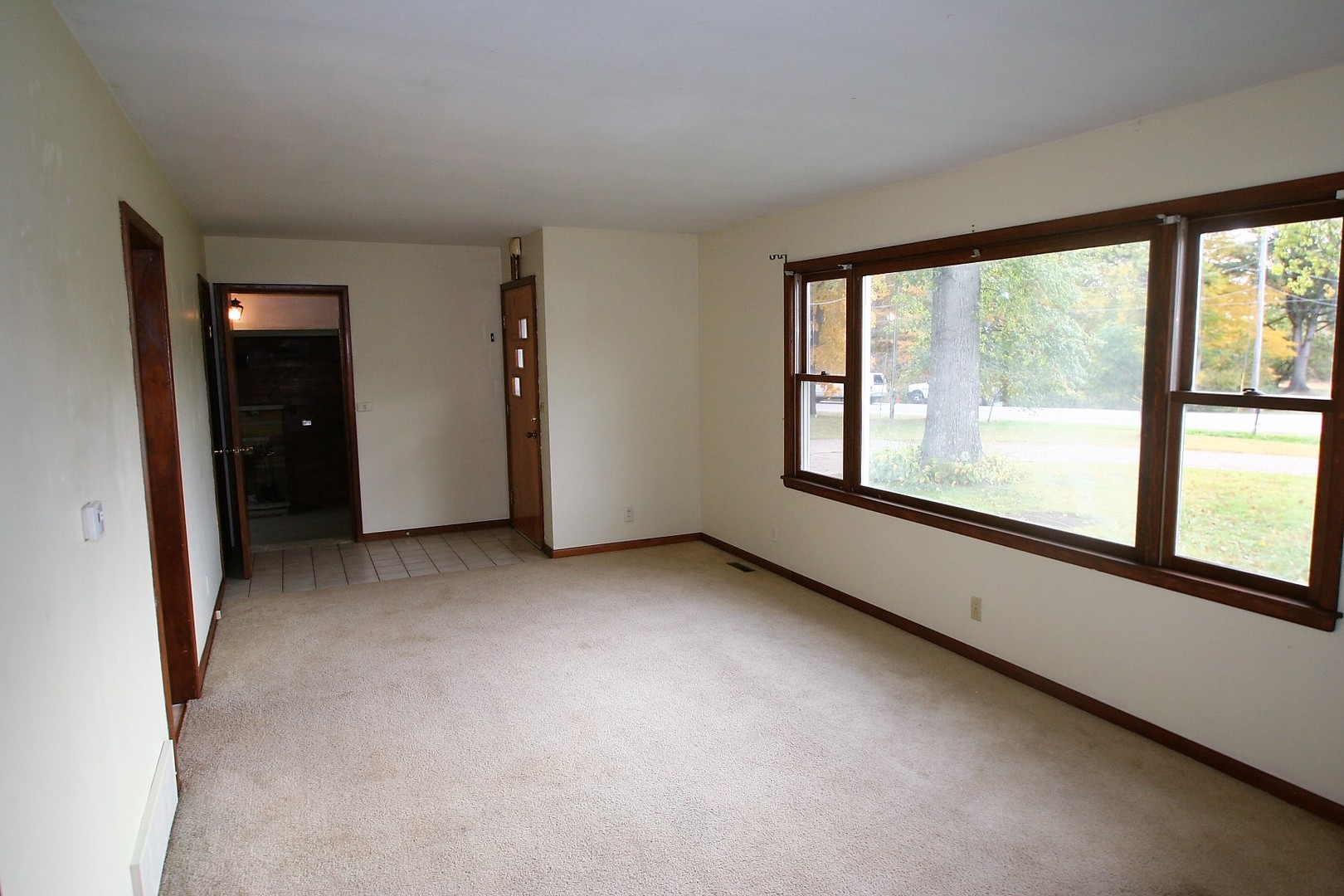 15998 Dee-Mac Road Mackinaw, IL 61755 - Photo 9 of 22 a view of an empty room with a large window