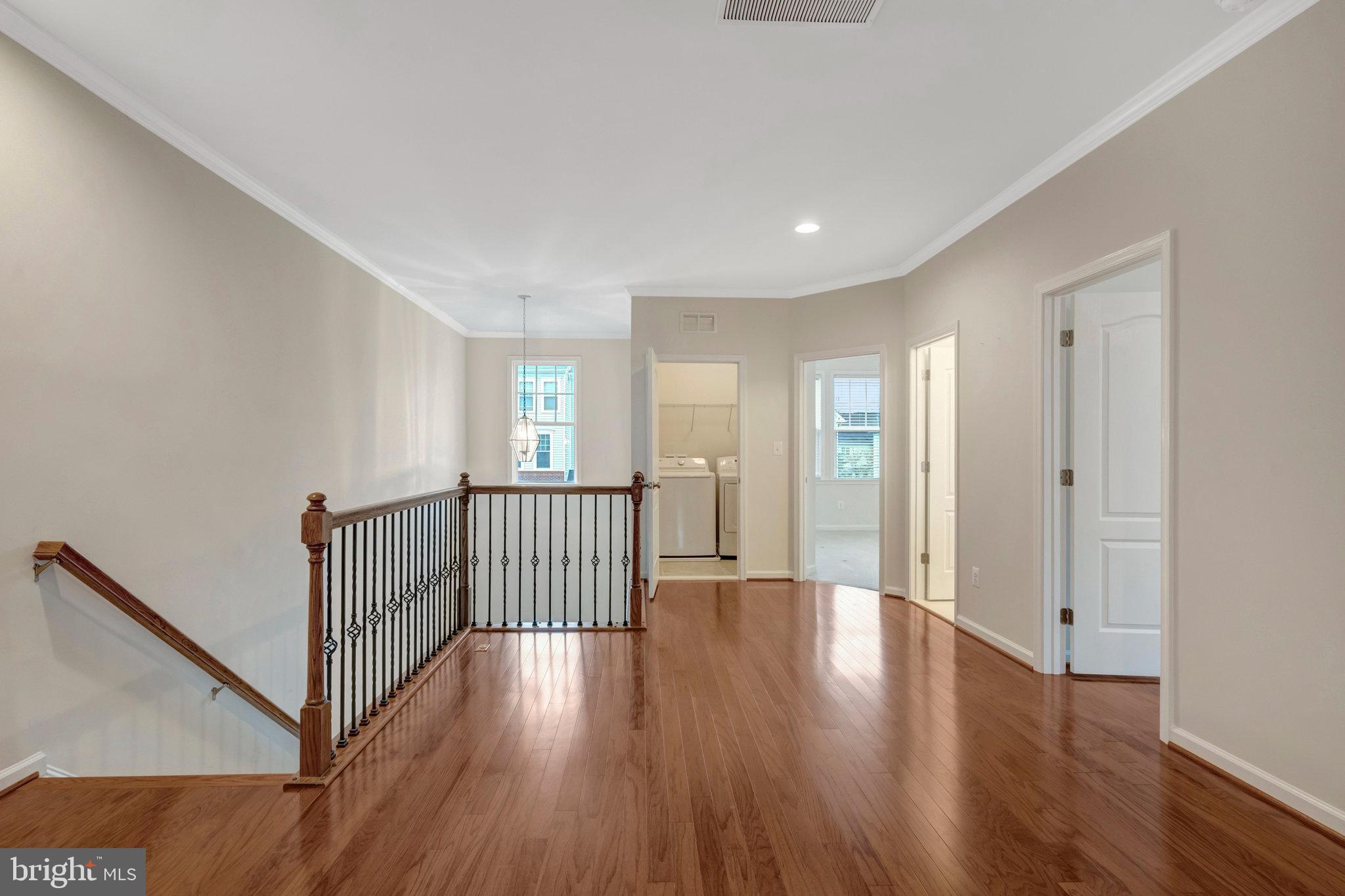 41841 Diabase Square Aldie, VA 20105 - Photo 19 of 45 a view of a hallway with wooden floor