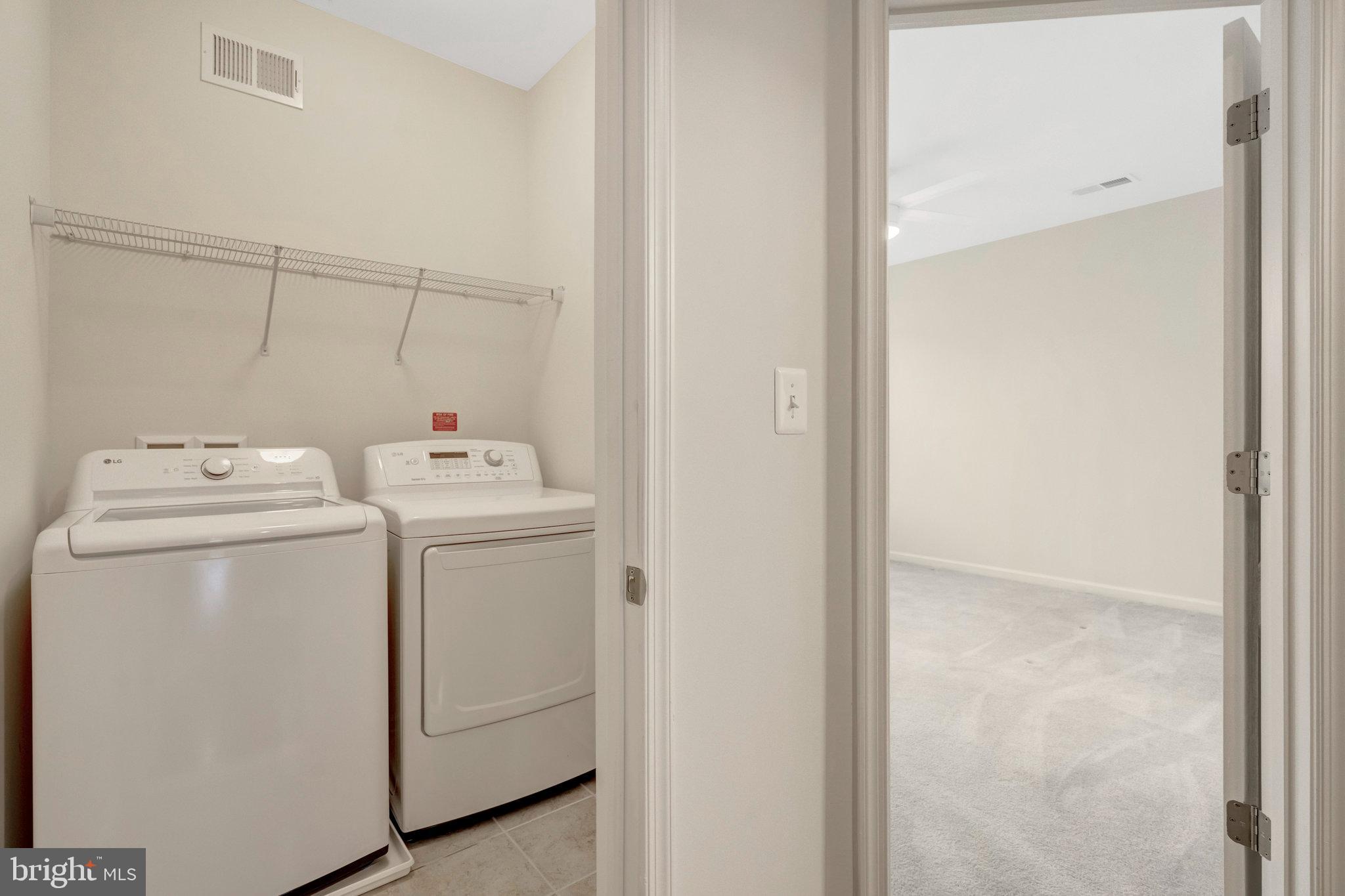41841 Diabase Square Aldie, VA 20105 - Photo 21 of 45 a utility room with dryer and washer