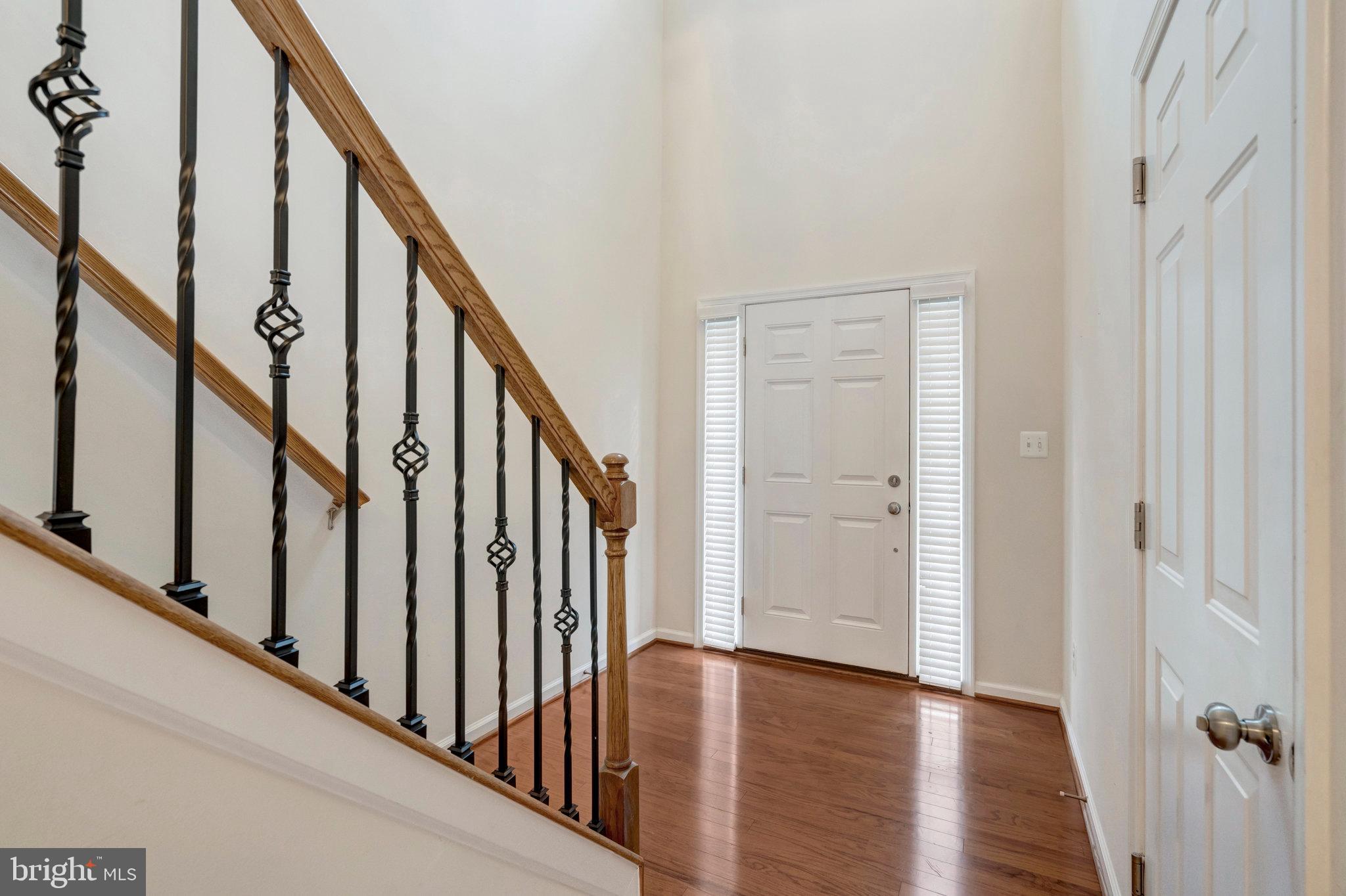 41841 Diabase Square Aldie, VA 20105 - Photo 4 of 45 a view of an entryway with wooden floor