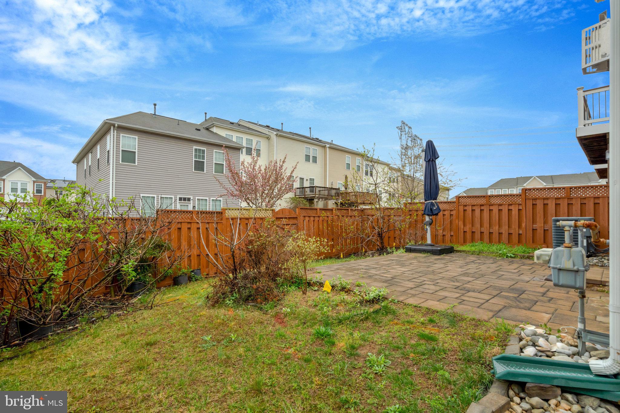 41841 Diabase Square Aldie, VA 20105 - Photo 42 of 45 a backyard of a house with wooden fence