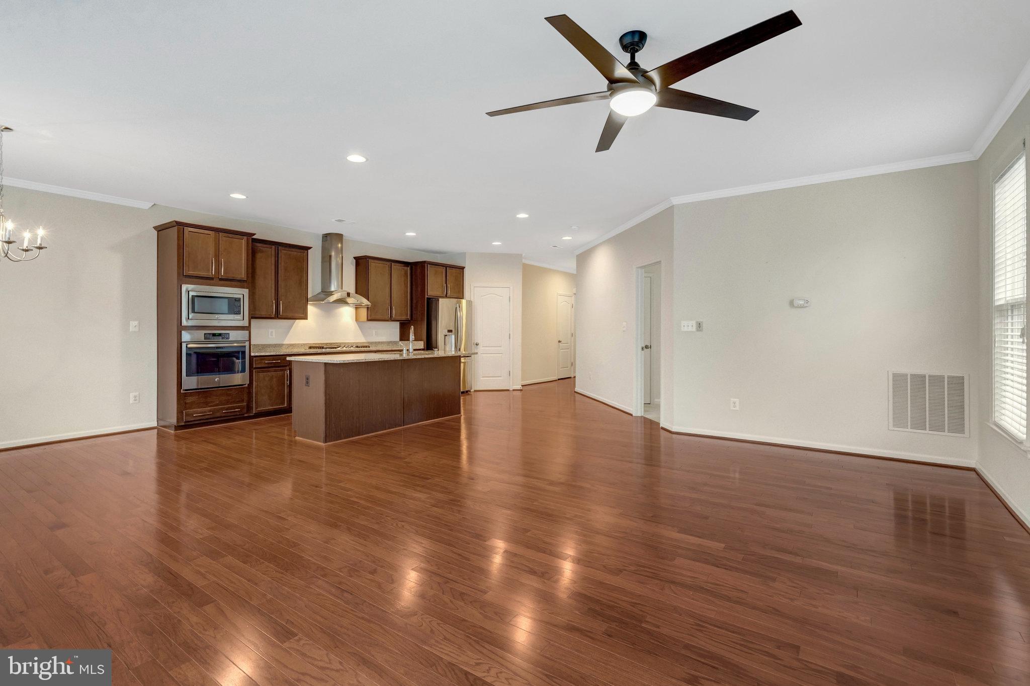 41841 Diabase Square Aldie, VA 20105 - Photo 7 of 45 a view of a kitchen with a stove cabinets and wooden floor