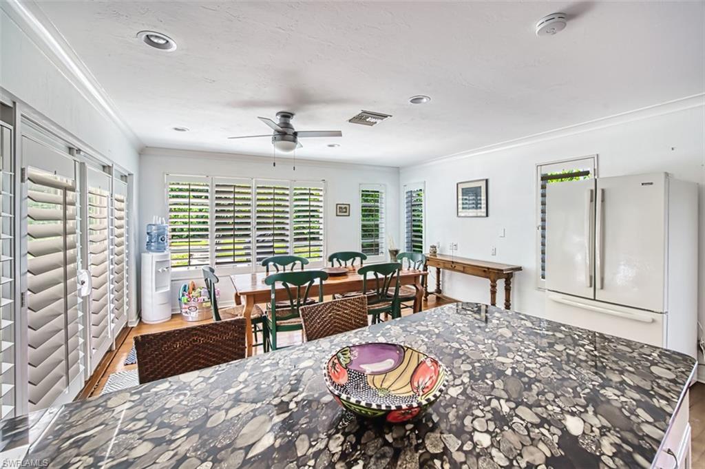2727 66th Street Southwest Naples, FL 34105 - Photo 25 of 33 kitchen to dining area