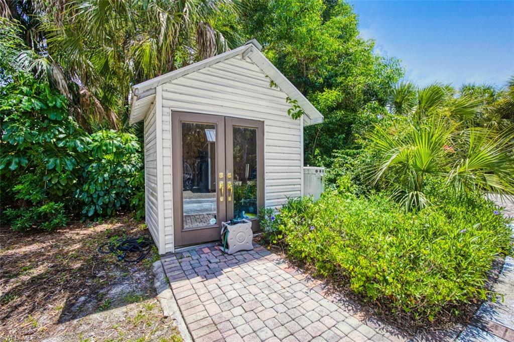 2727 66th Street Southwest Naples, FL 34105 - Photo 29 of 33 well house with storage